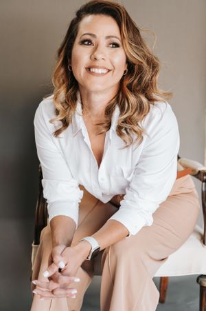 Lifestyle portraits in white button-down shirt with relaxed casual poses.