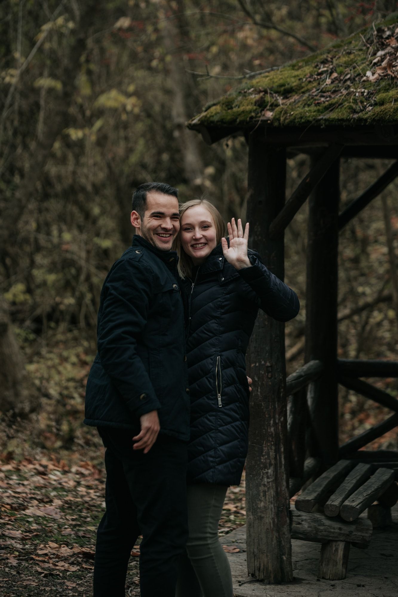 Engaged-couple-waving