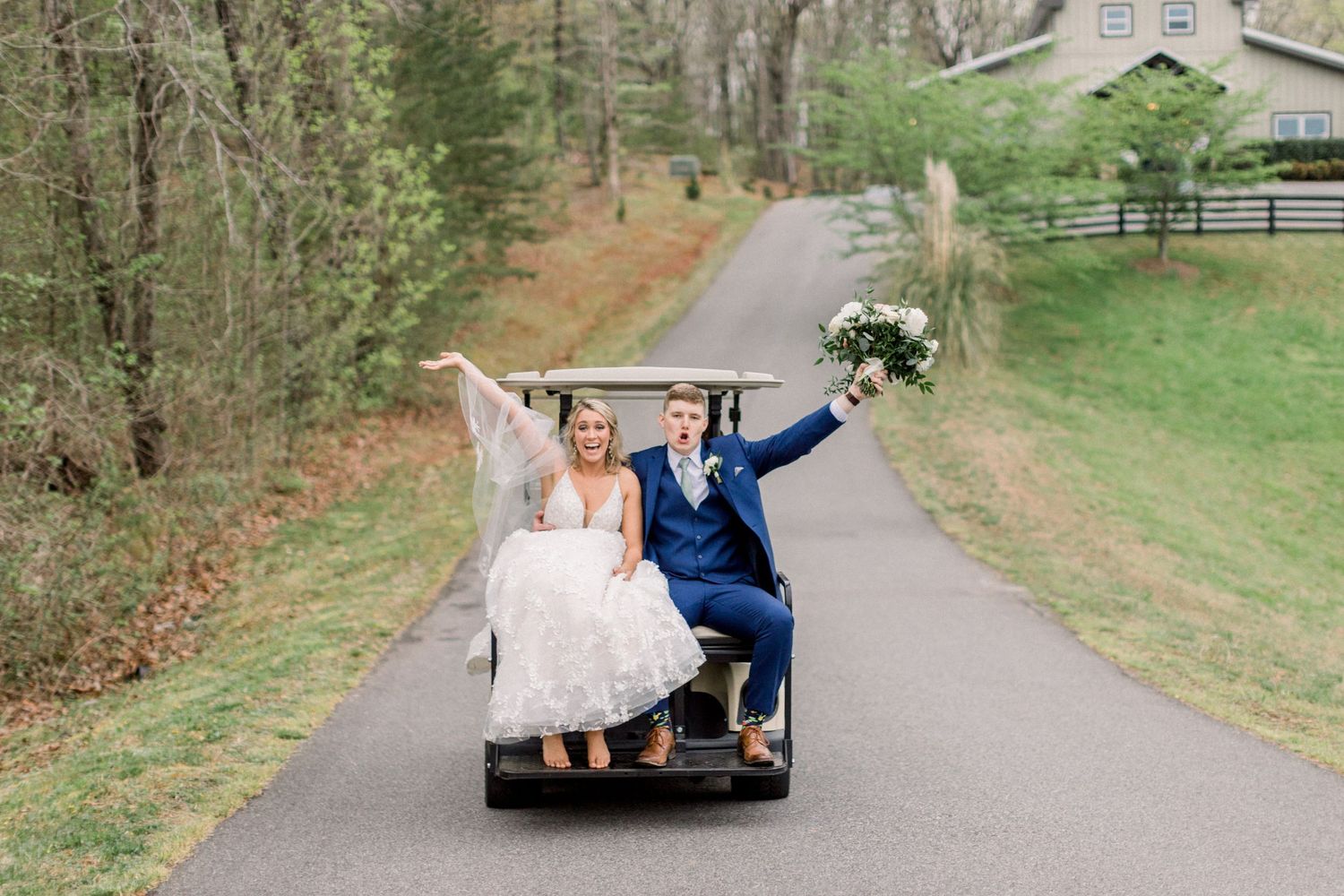 bride and groom on golf cart after wedding portraits at blue mountain vineyards dahlonega ga