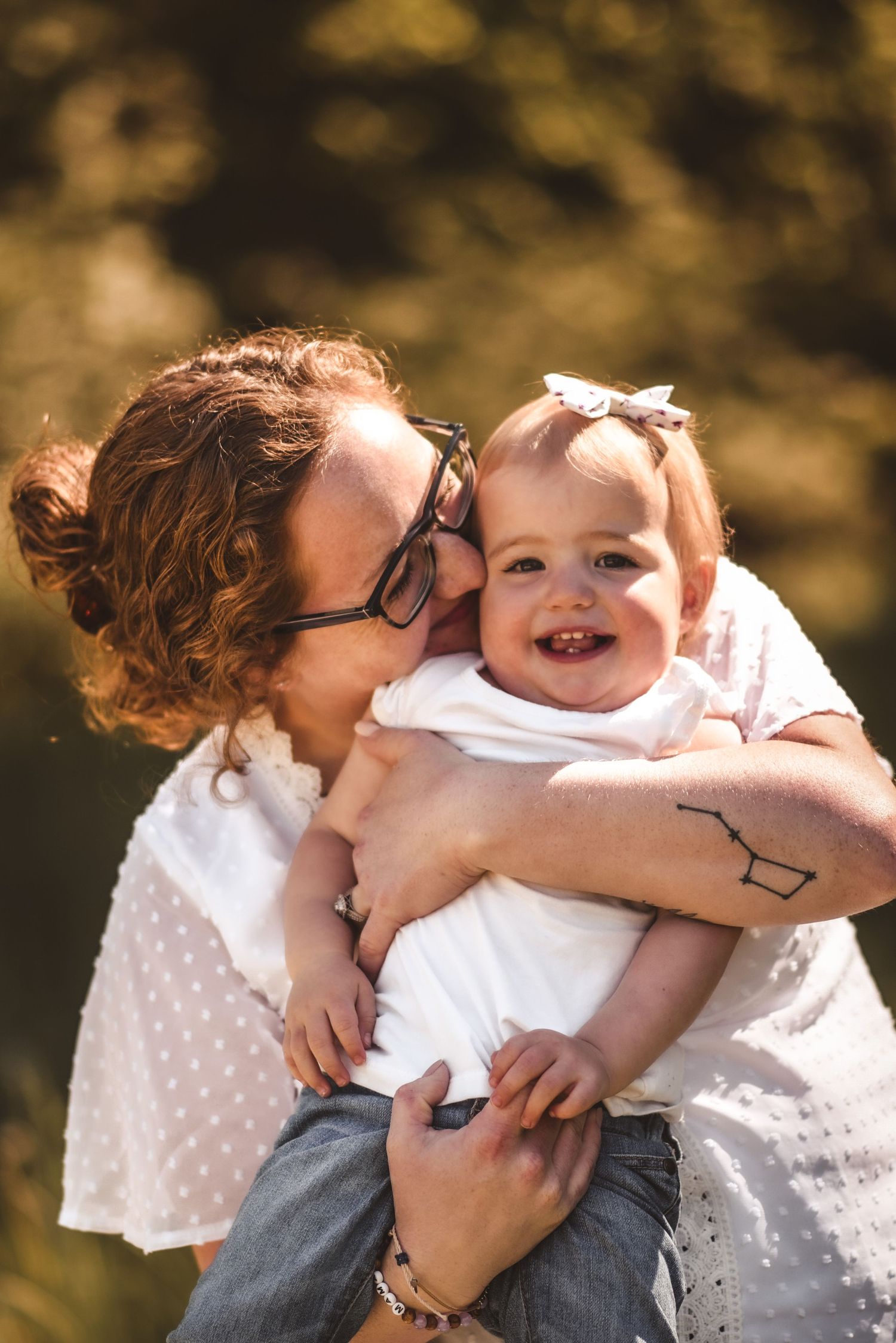 Intimate outdoor portrait session with natural golden lighting.