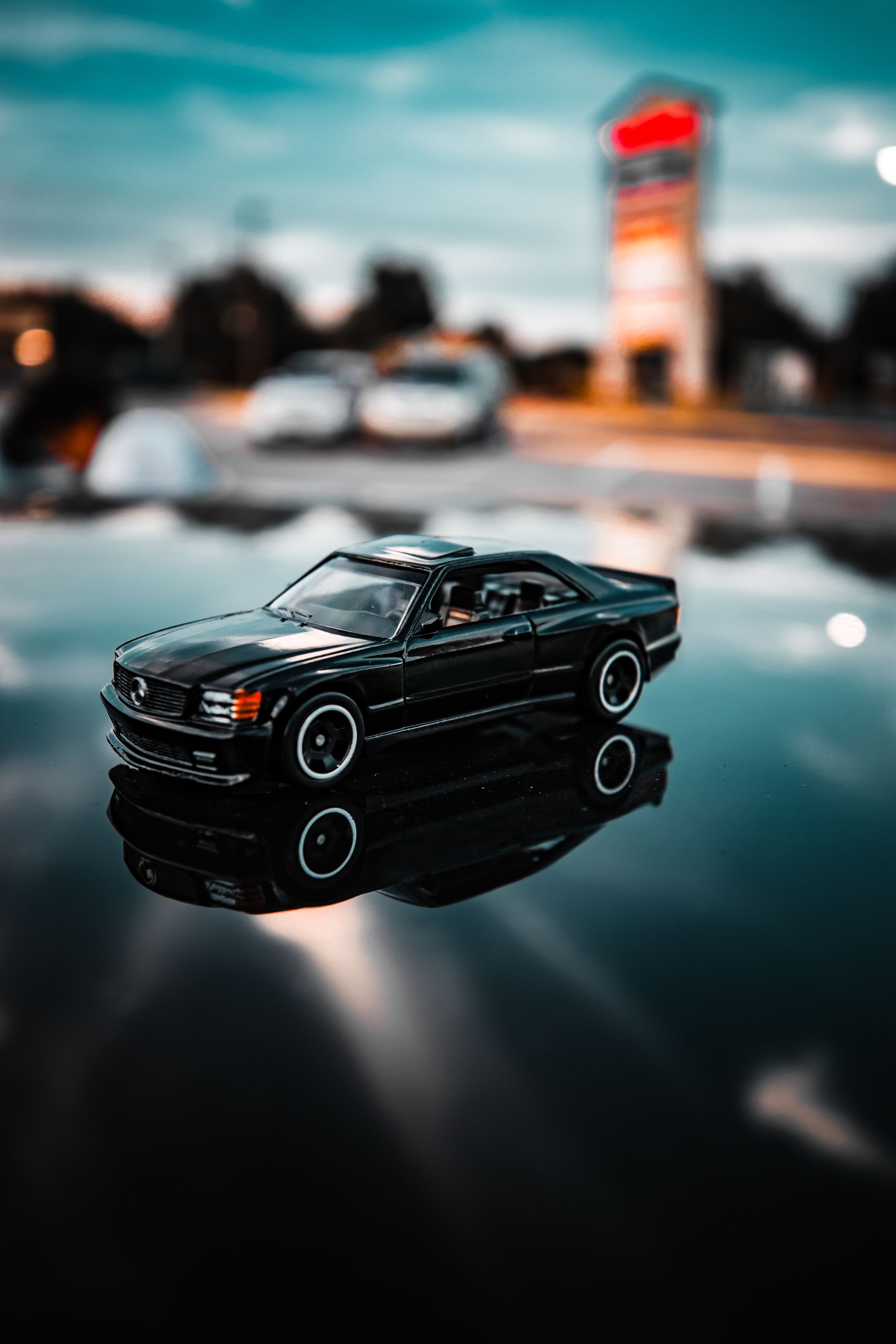 Miniature car on a roof of a car