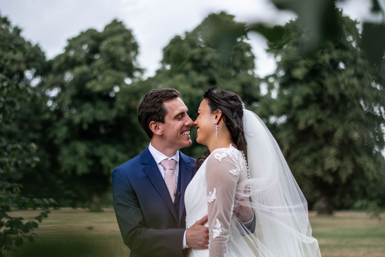 Intimate wedding portraits captured in a lush garden setting.
