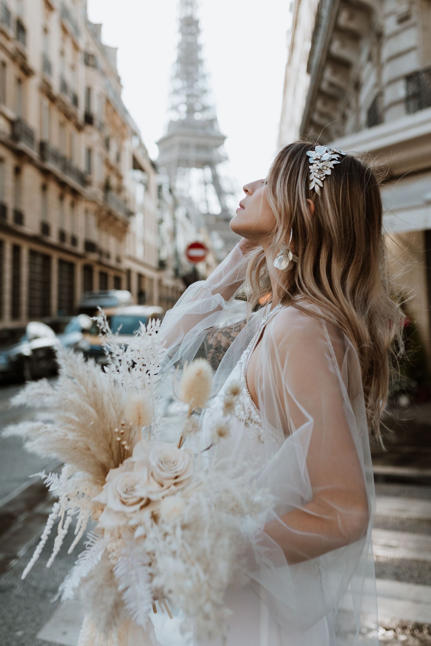 Bride taking a deep breath under Eiffel tower