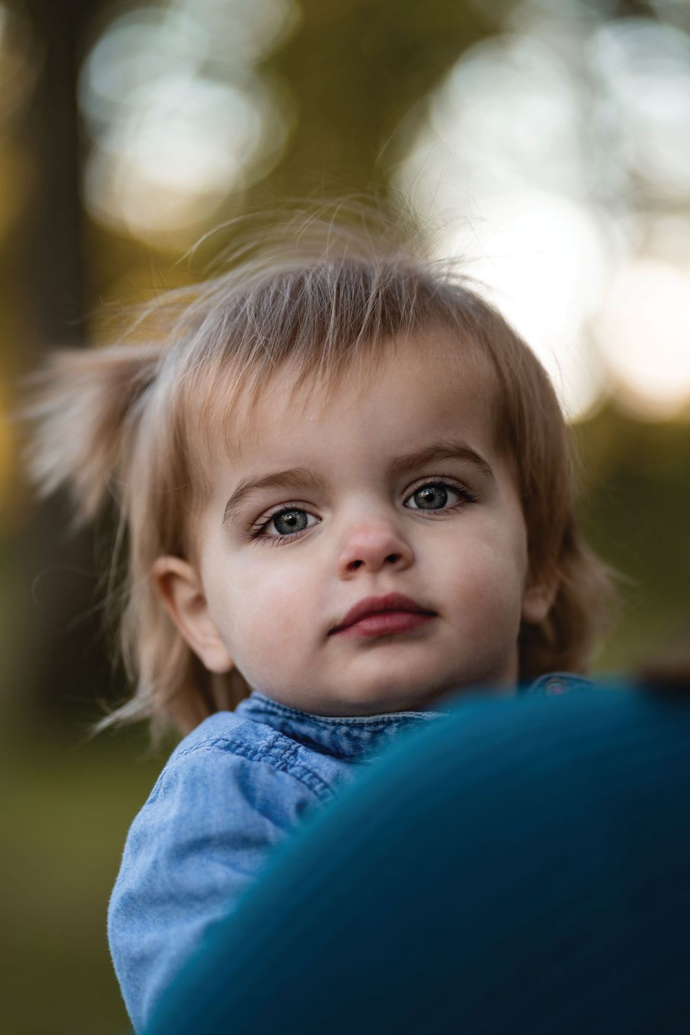 Daughter over mother's shoulder at Water Works Des Moines