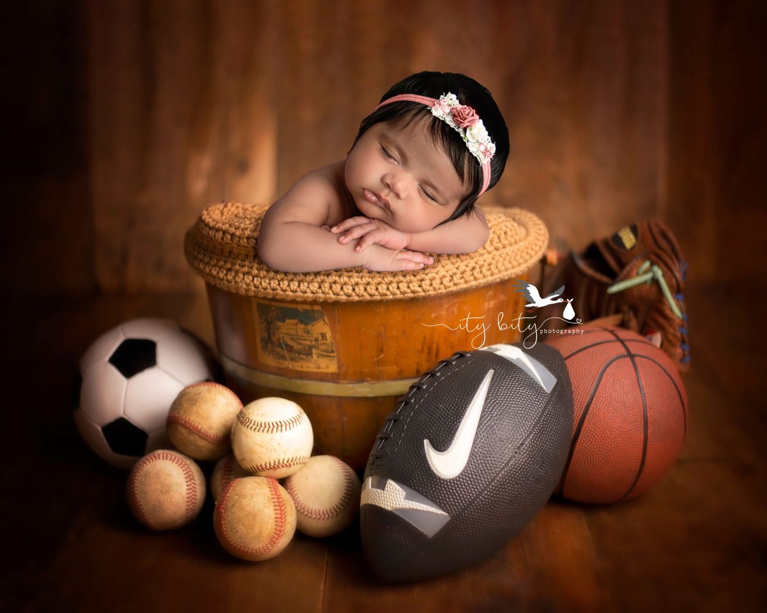 Baby Girl in sports newborn baby set by Ity Bity Photography Cleveland Ohio NFL