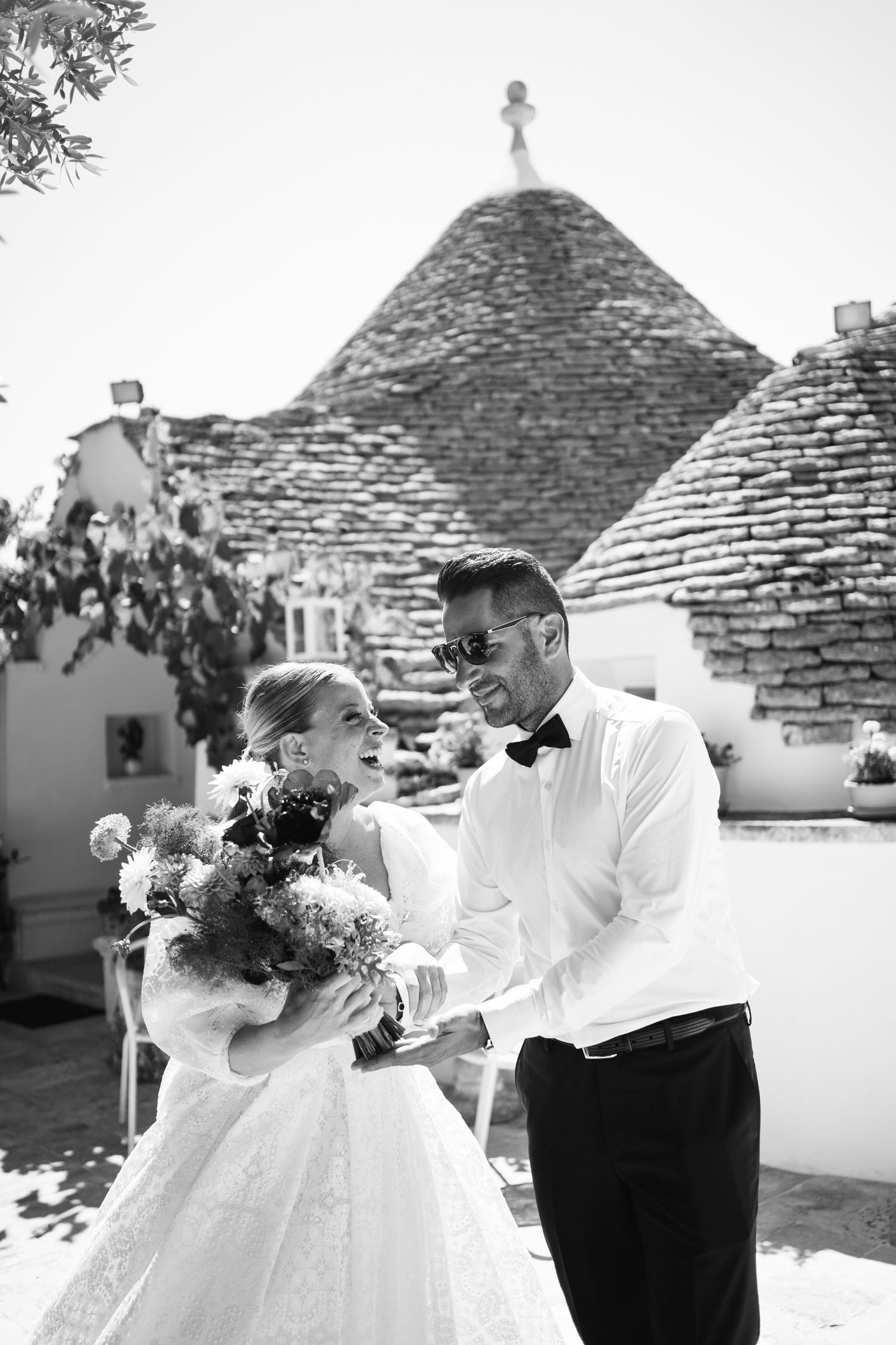 Wedding photography sequence with traditional stone buildings in background.