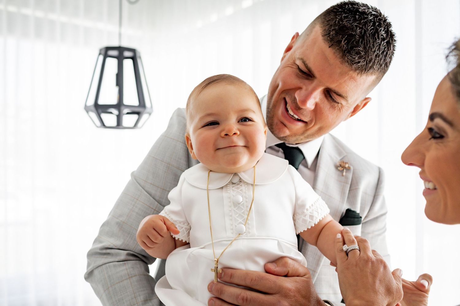 A heartwarming moment shared in a bright white room with modern decor.