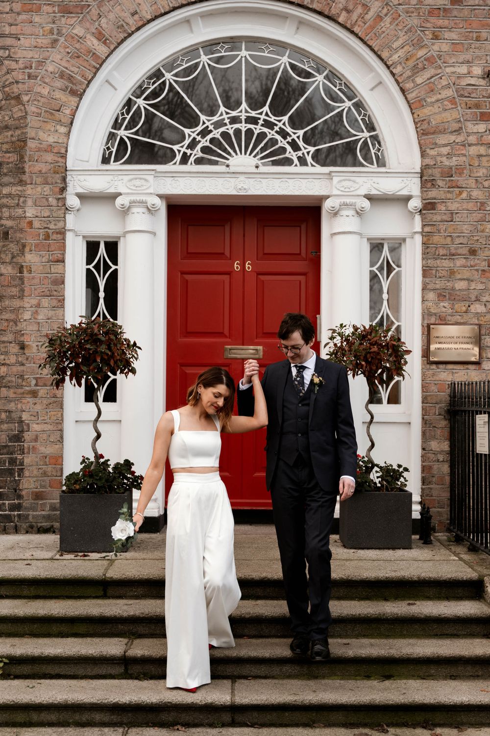 Red door. Bride and groom. Modern bride. Smiling groom. The best wedding photographer in Dublin, Ireland. Eloping in Ireland.