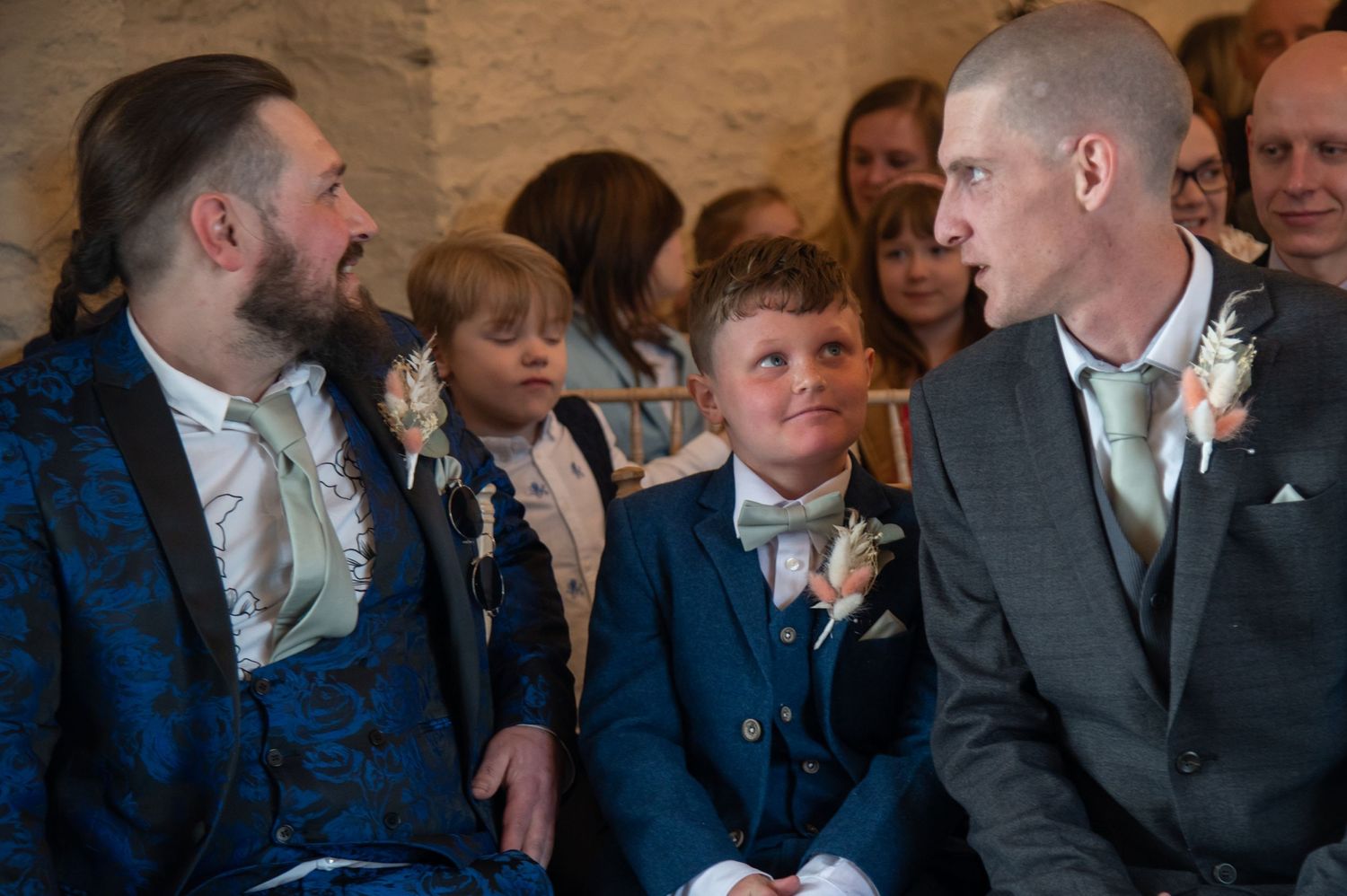 Wedding guests mingle and socialize during a reception celebration.