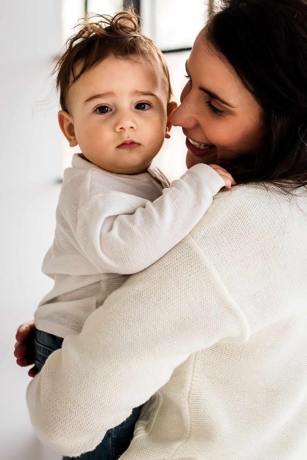 Love & Sunshine Photography: Mom and baby boy cuddles during spring mini session at Studio Boheme in Calgary AB.