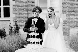Bride and groom with the Champagne Tower during their destination wedding in France.