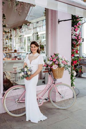 Bride with the pink bike. London Town hall wedding. London wedding photographer.