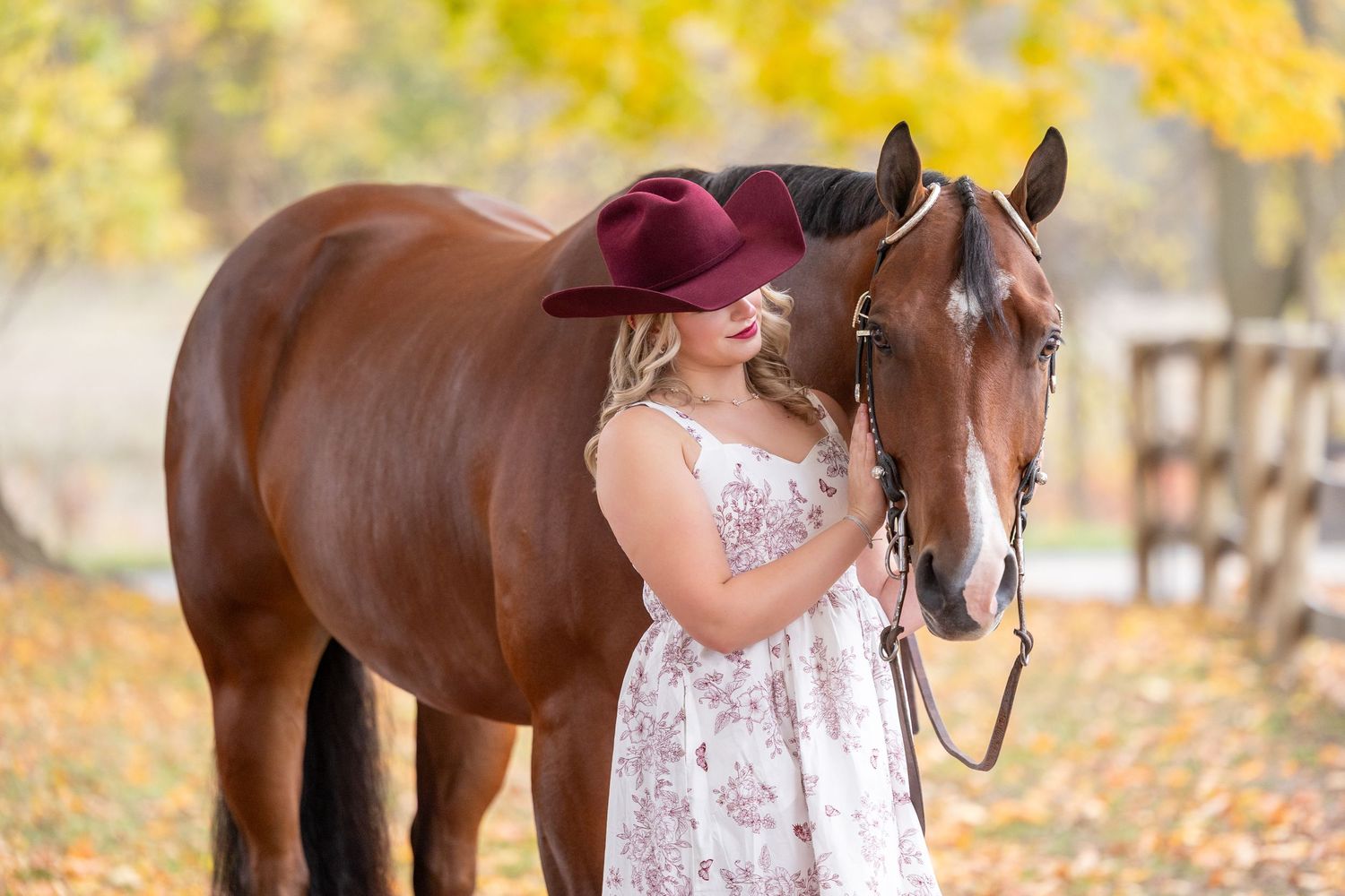 Hailey Smith with Geoffrey under fall leaves in Caledonia, Michigan