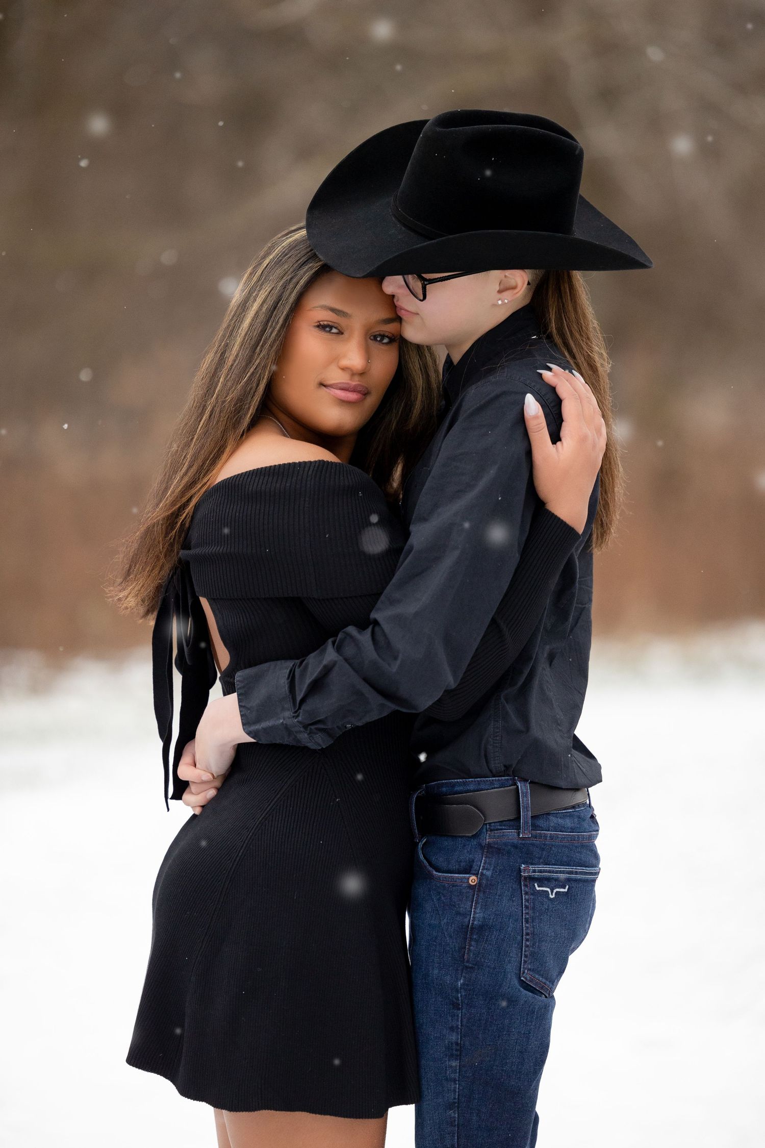 couple embracing in a loving hug in the snow