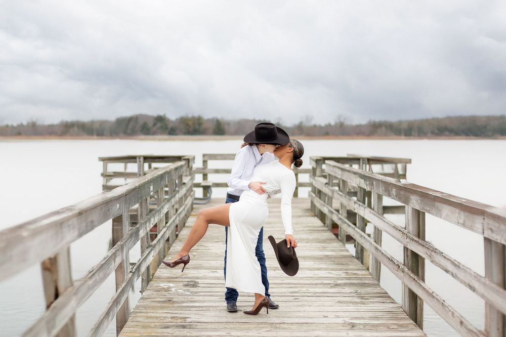 couple engagement shot dip on pier