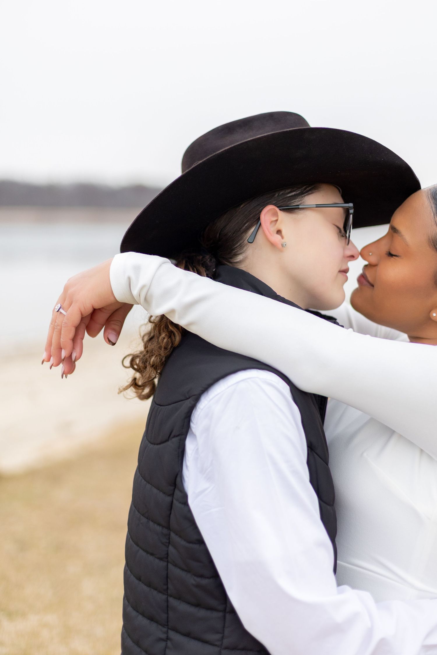 couple engagement shot hugging