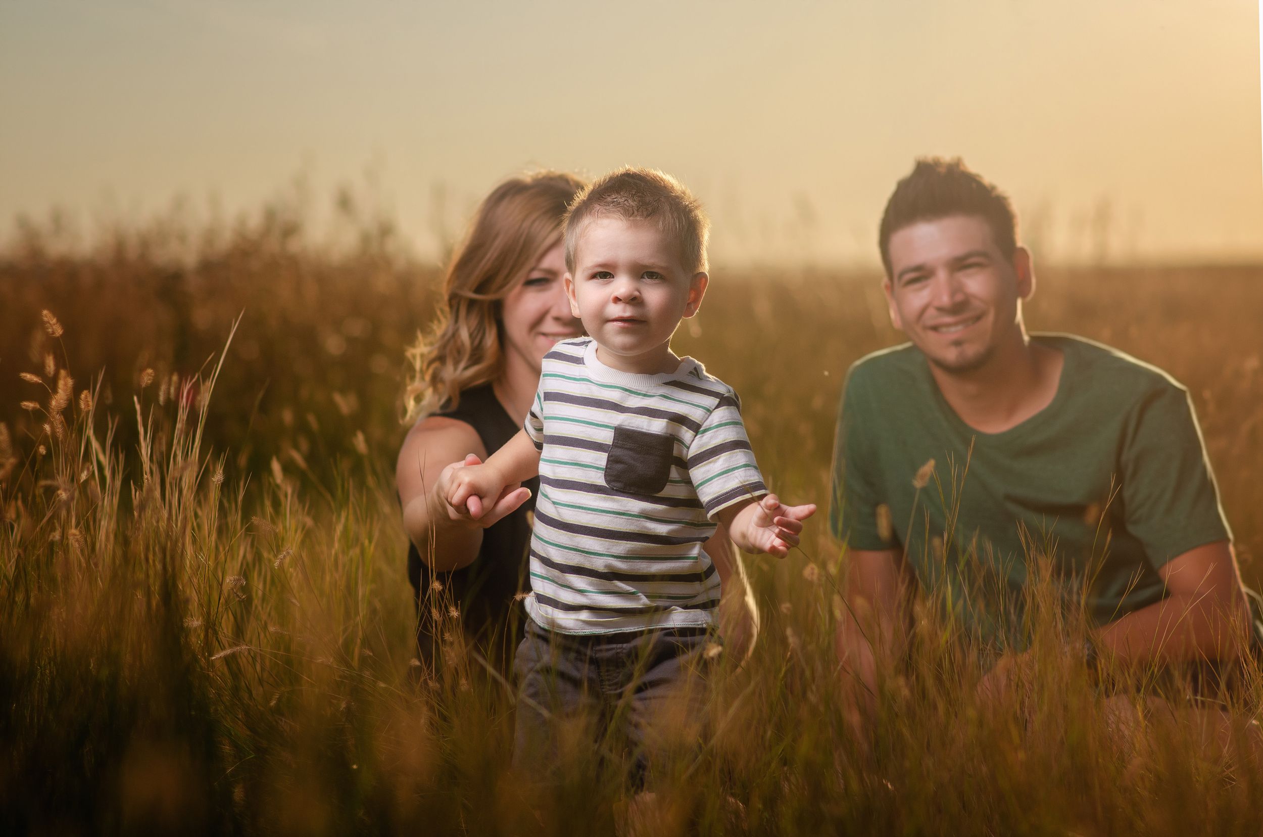 Young boy and a mom and dad.