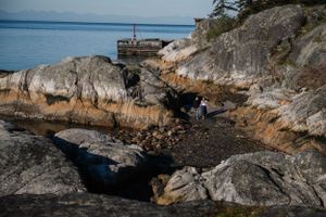 Rocky coastal landscape with rugged cliffs and ocean views in the Pacific Northwest.