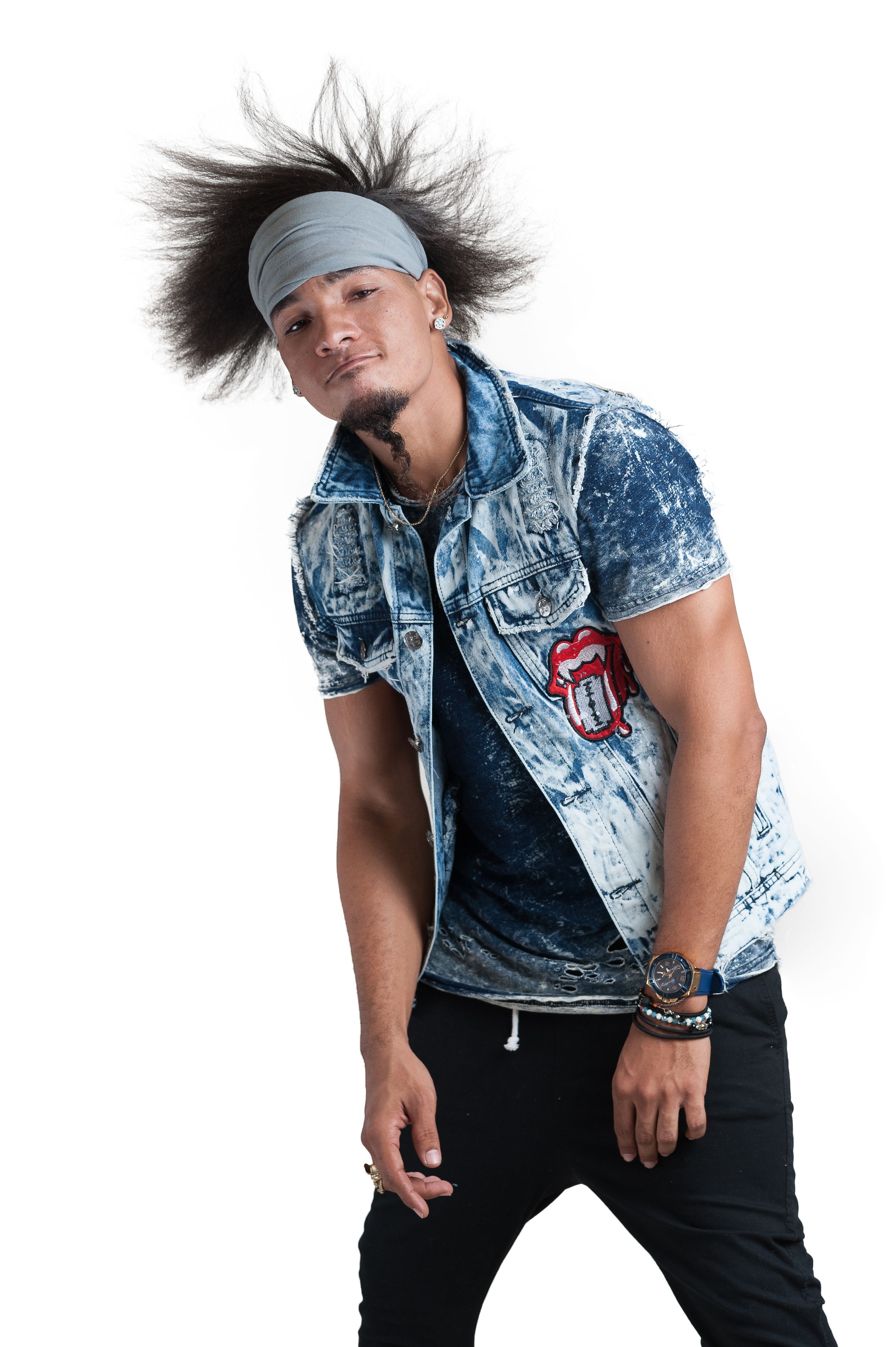 Dynamic portrait of someone in an acid-washed denim vest and bandana with spiky hair striking a casual pose.