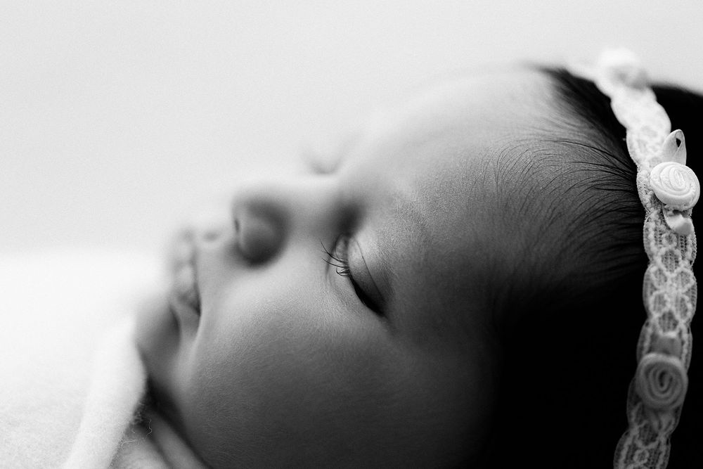 Black and white detail newborn photo of baby profile with focus on eyelashes, natural light in Phoenix AZ by Jen Roberts