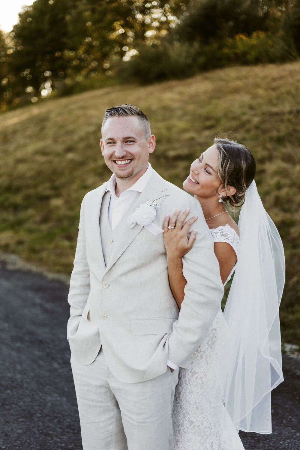 A romantic wedding photoshoot sequence showing a couple in white attire sharing tender moments outdoors at sunset.