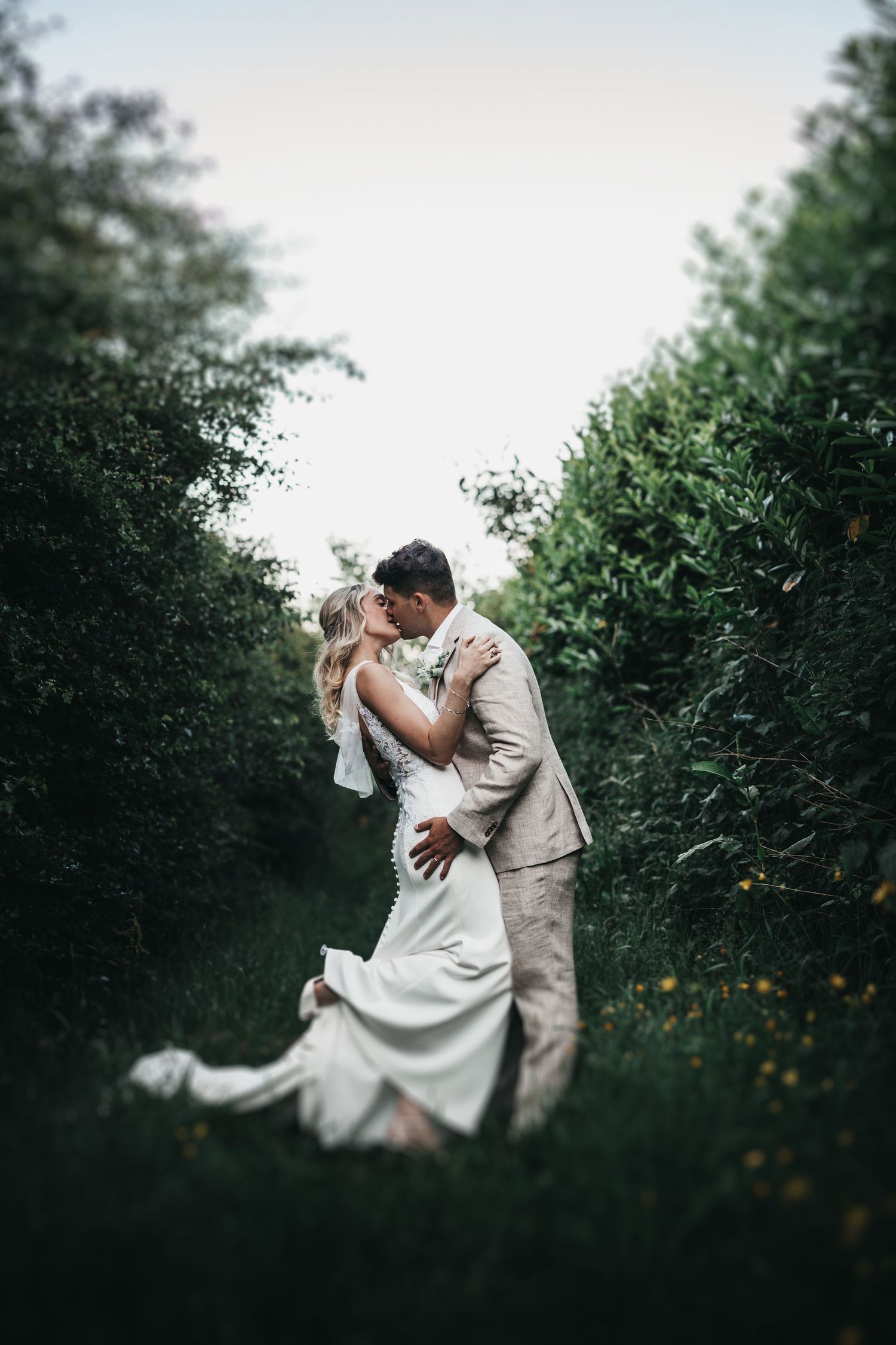 bride and groom kissing in natural setting at a peak district wedding