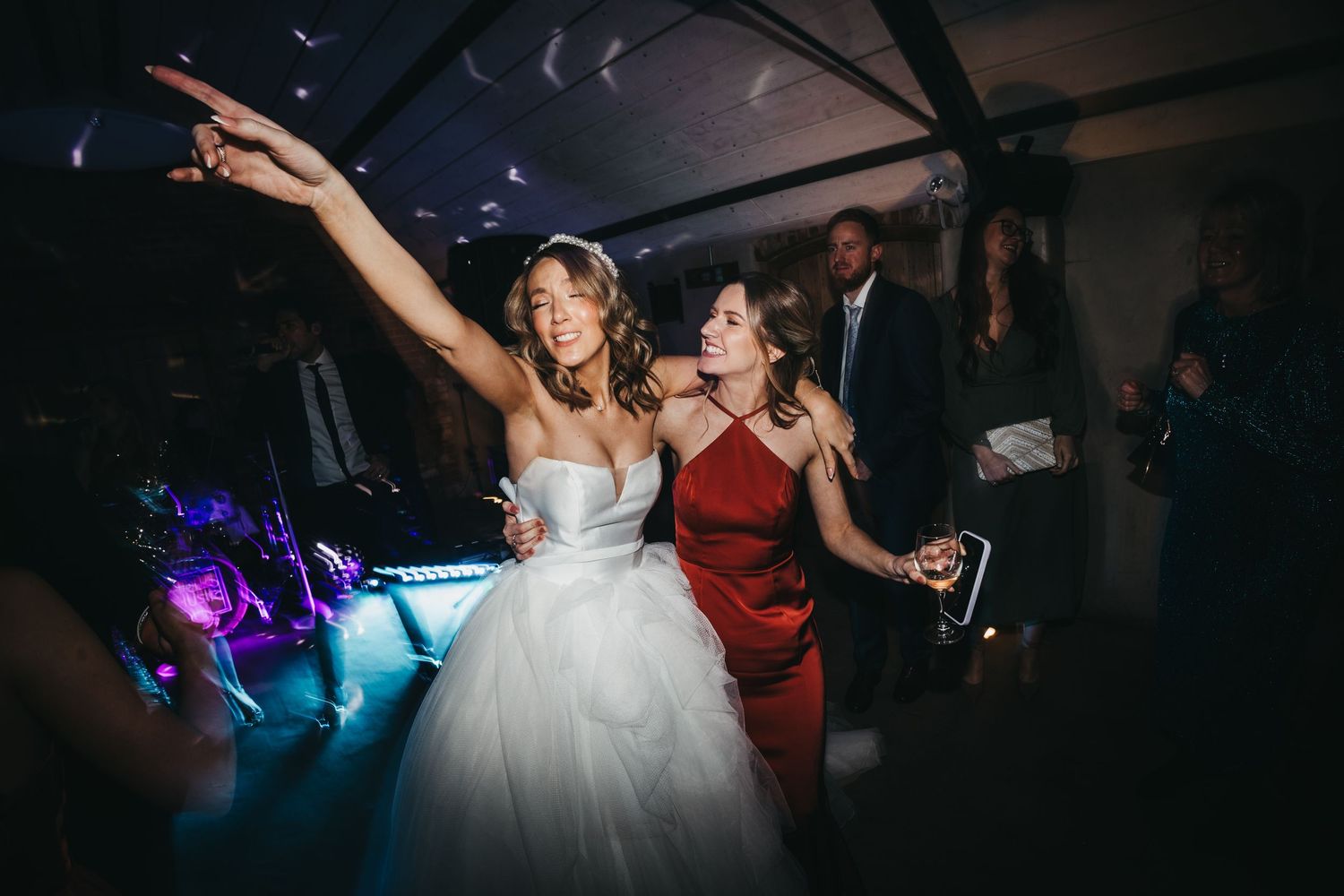 Bride and maid of honour dancing at Grangefields
