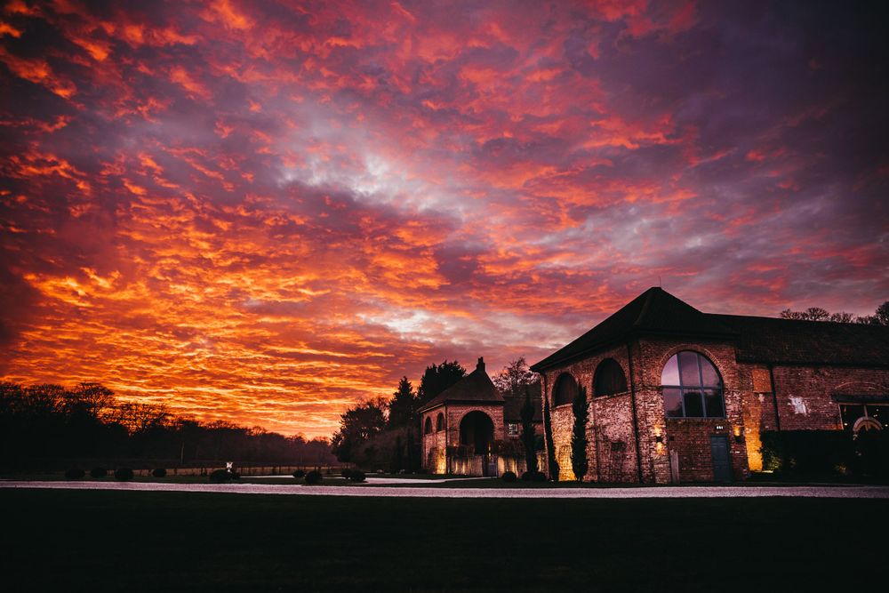 A dramatic red sunset over Hazel Gap wedding venue