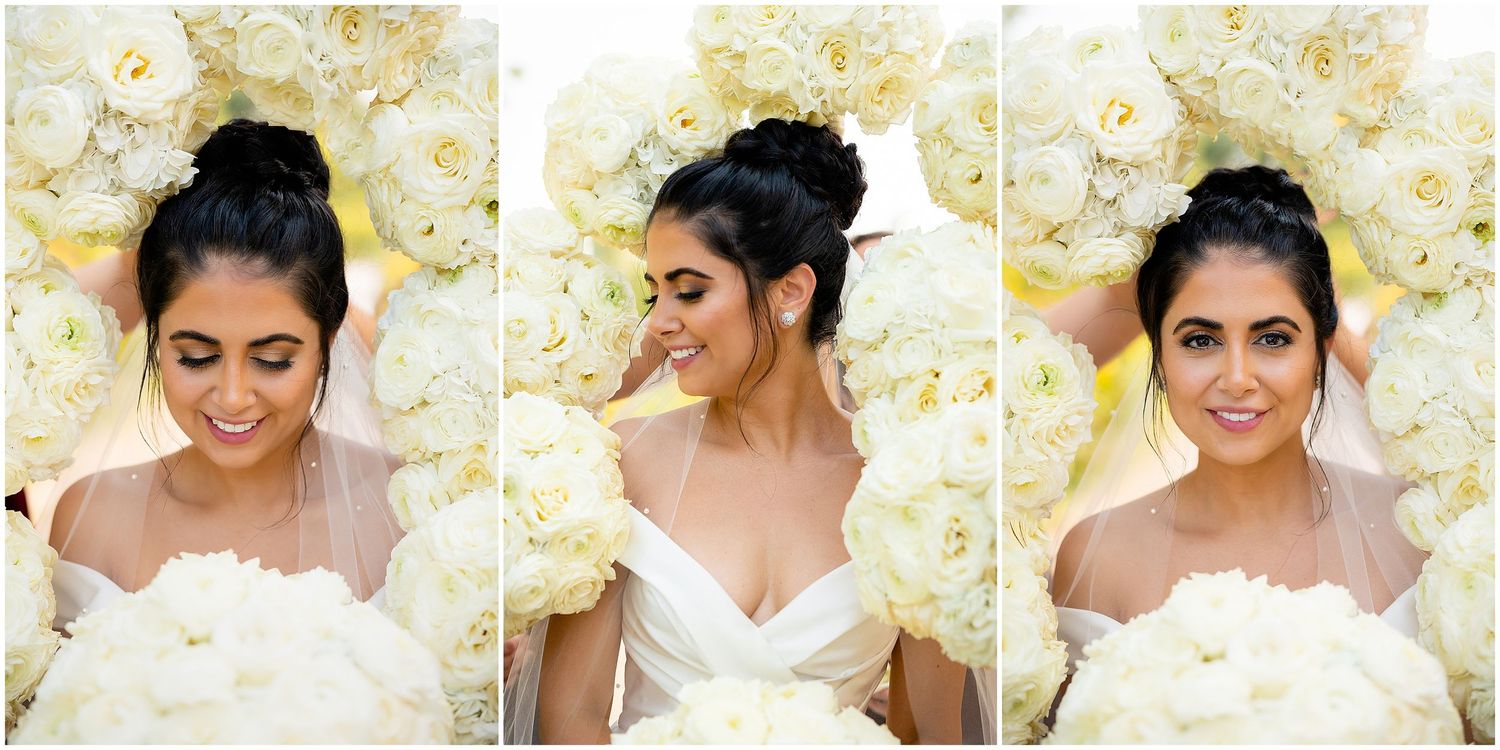 Bridal beauty portraits against white floral backdrop showing elegant updo hairstyle.