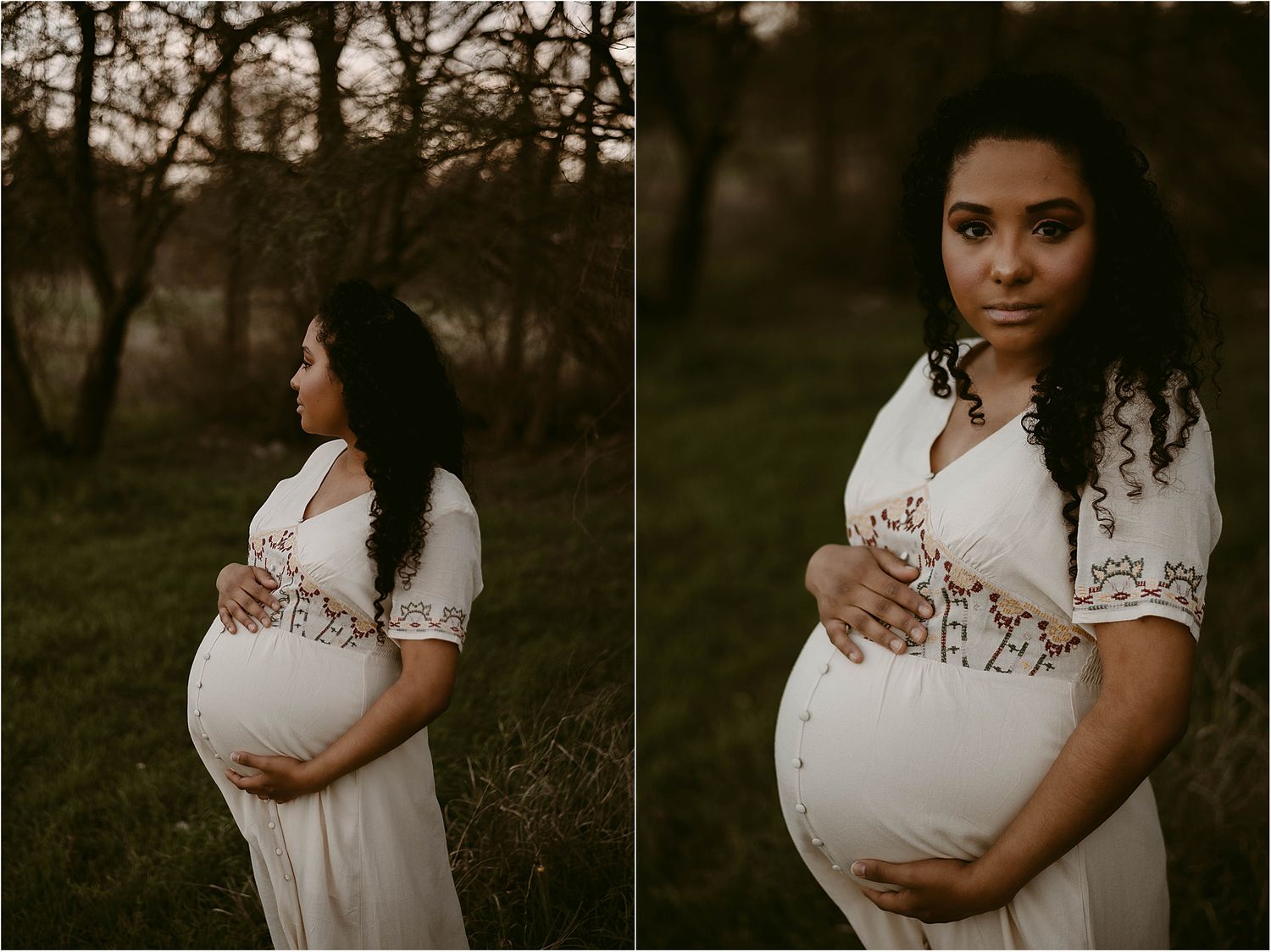 Artistic maternity photos captured in moody lighting with a white embroidered dress against a dark forest backdrop.