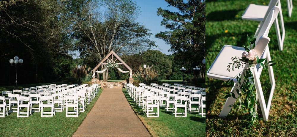 Outdoor wedding ceremony setup with white chairs lined up leading to a rustic wooden arch.