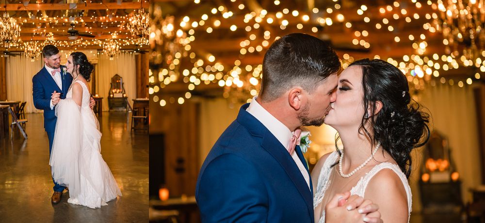 Romantic moment captured under twinkling lights at an elegant indoor wedding venue.