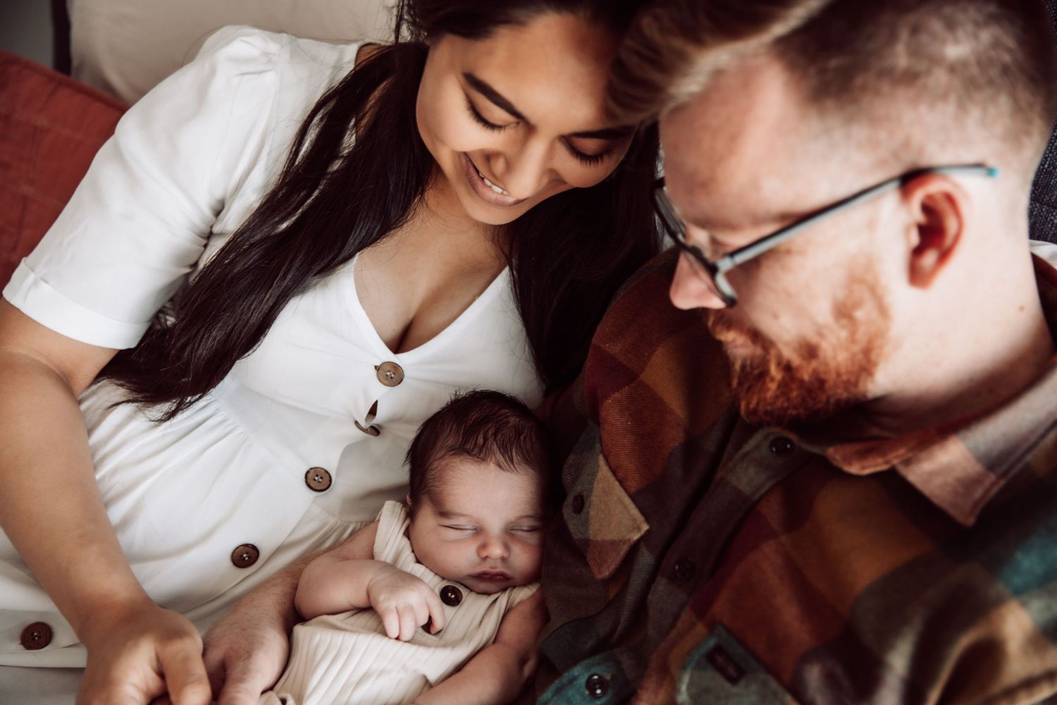 Close-up lifestyle family photography in natural window light with muted tones.