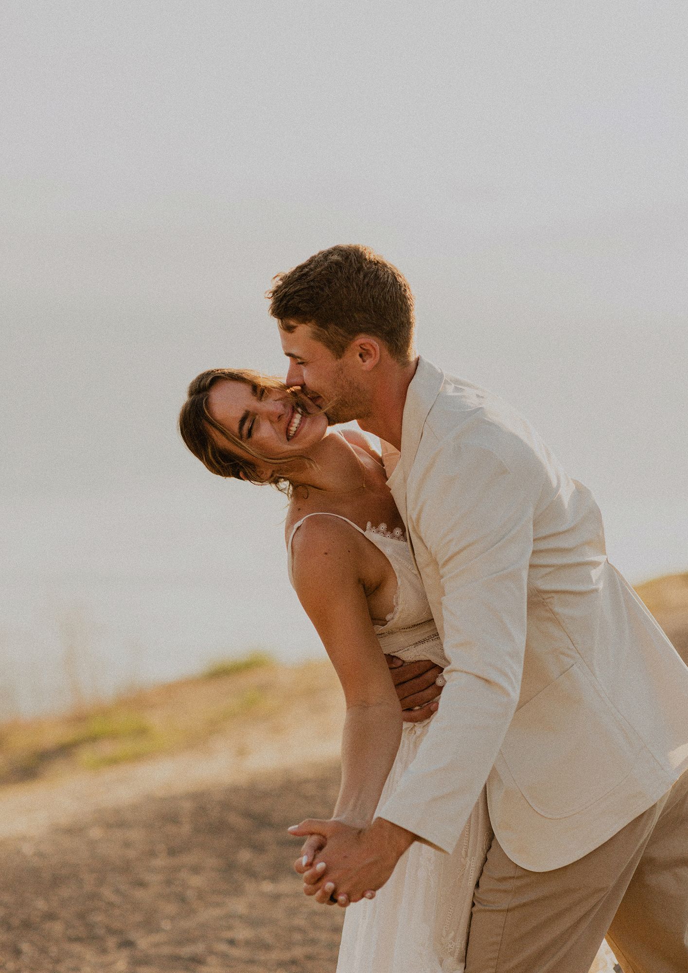 Bride and groom couple's portraits after a Palos Verdes cliffs wedding overlooking the ocean