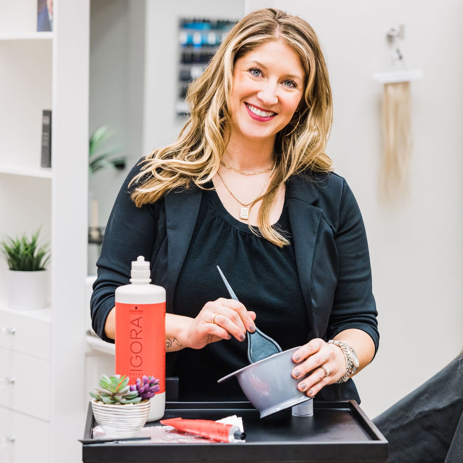 personal branding image of stylist mixing color for client in hair salon