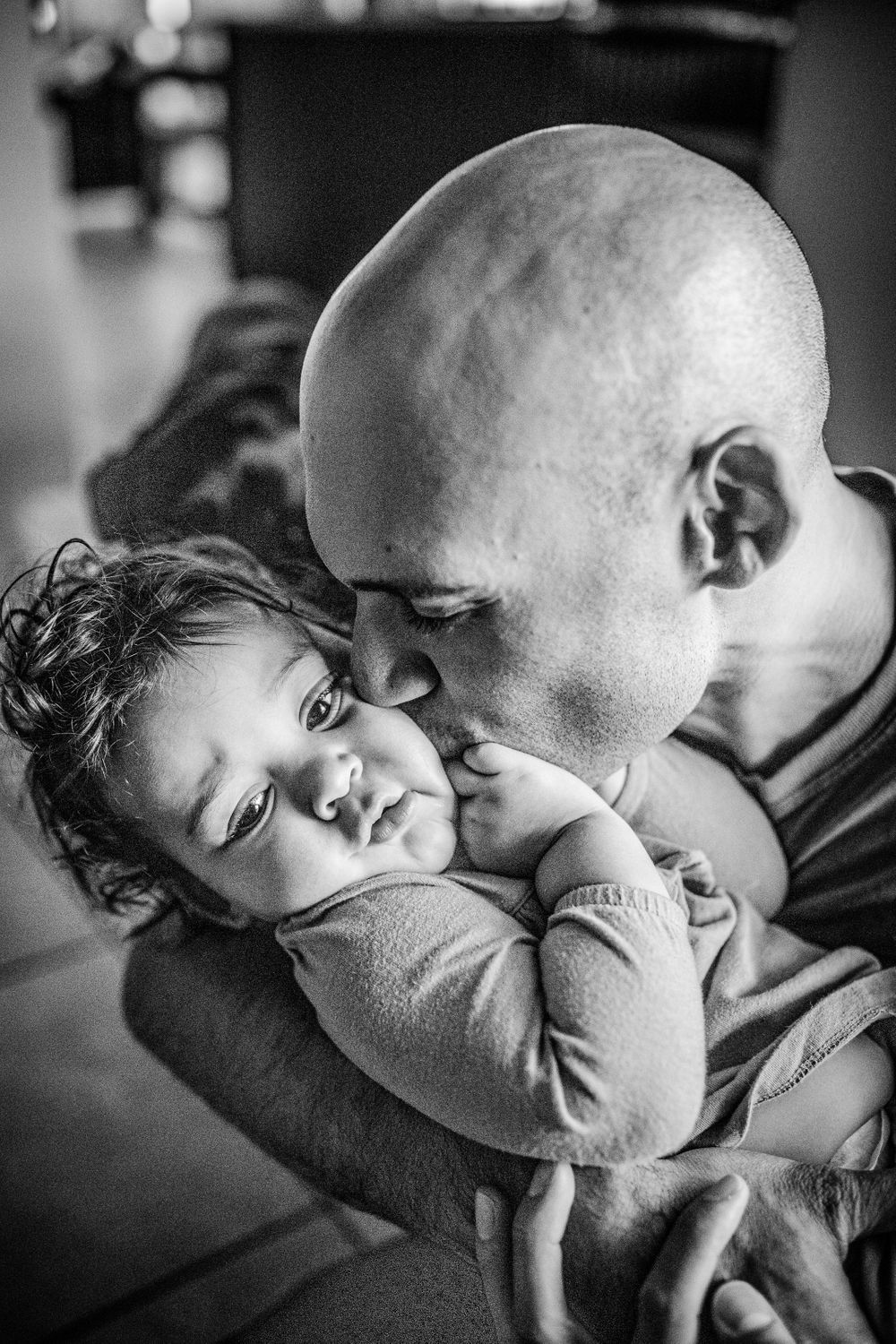 father kissing daughter