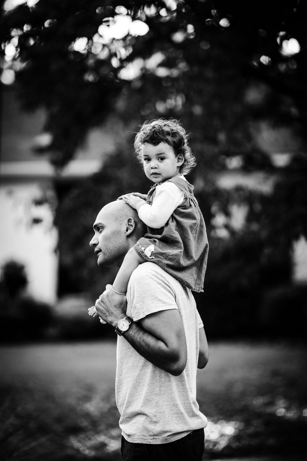 father and daughter on shoulders