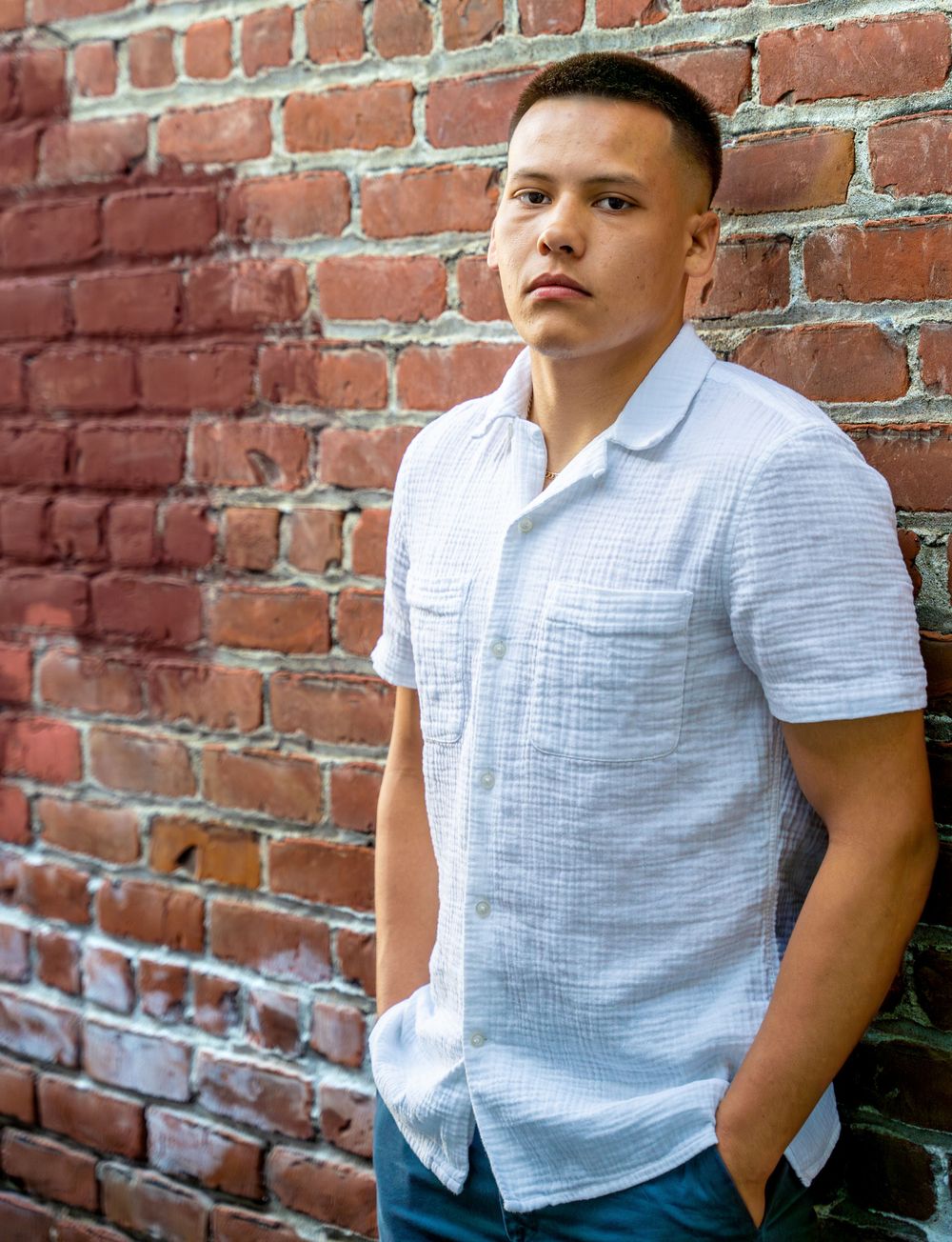 Stylish and confident young man showcasing his charm in a street photoshoot