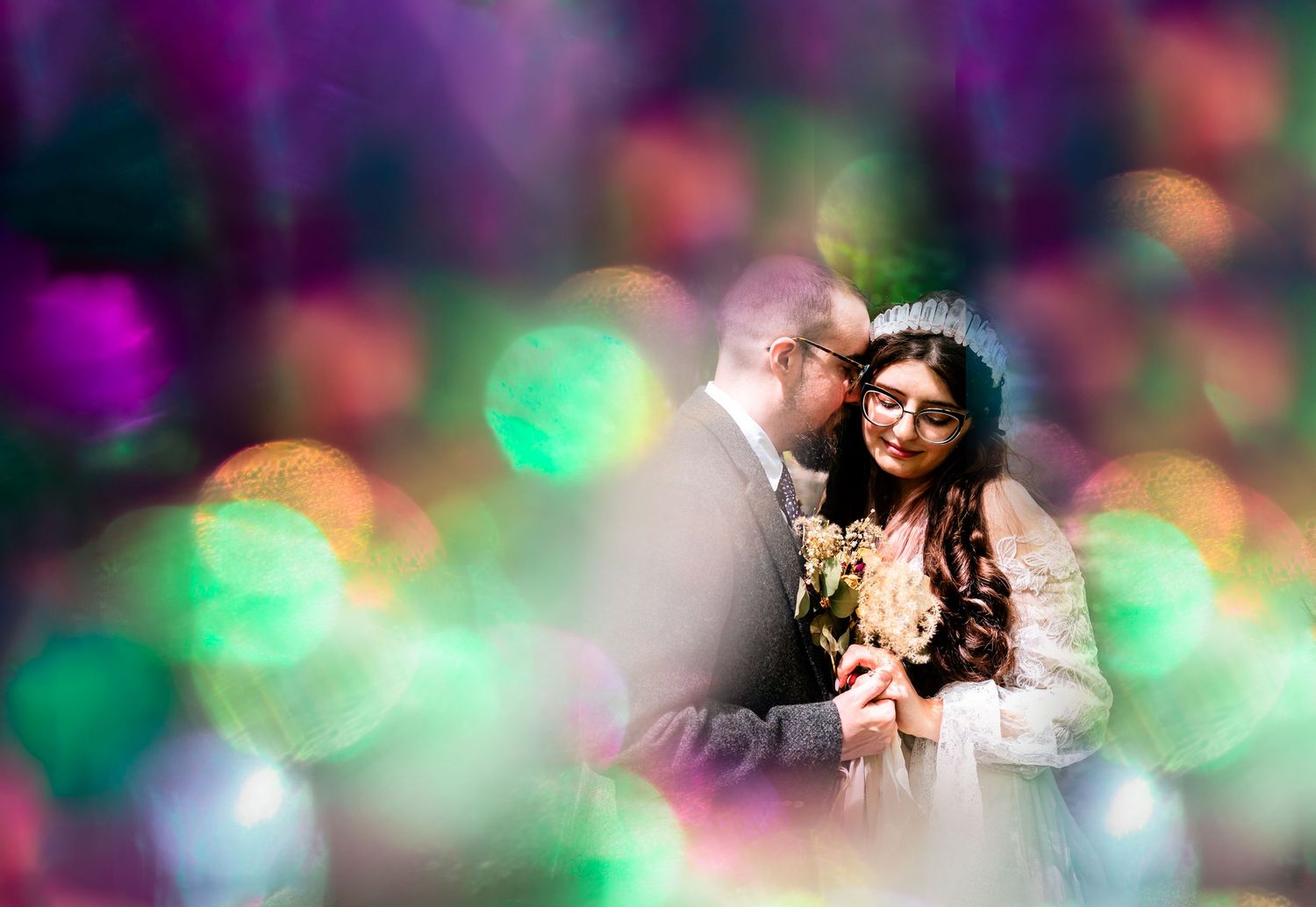 Colorful bokeh lights create a dreamy atmosphere at an evening celebration.