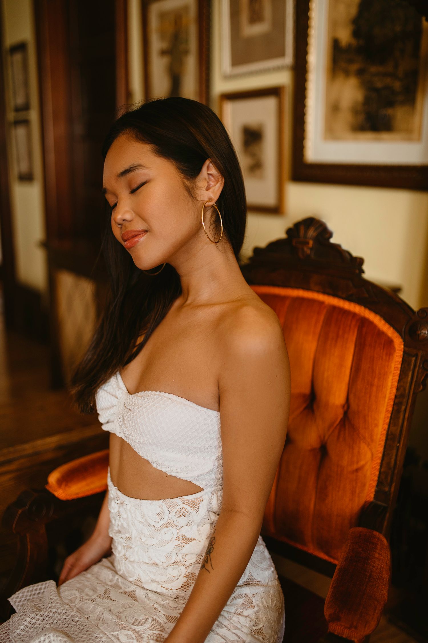 Gold hoop earring and white dress outfit