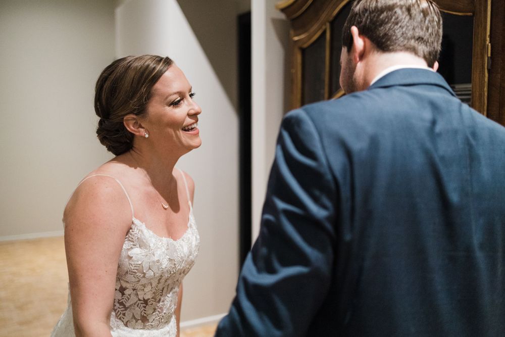 Wedding couple shares intimate moment during first look.