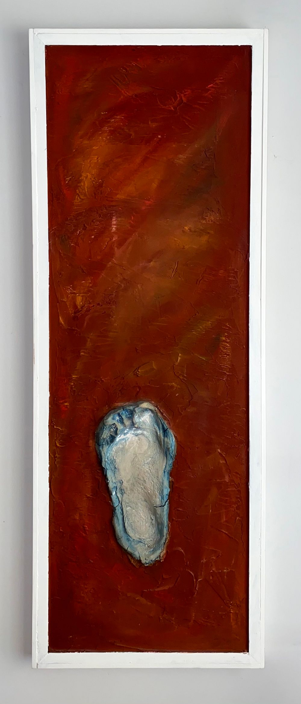 'Earthly' mixed media painting on canvas. Blue footprint on a deep red background.