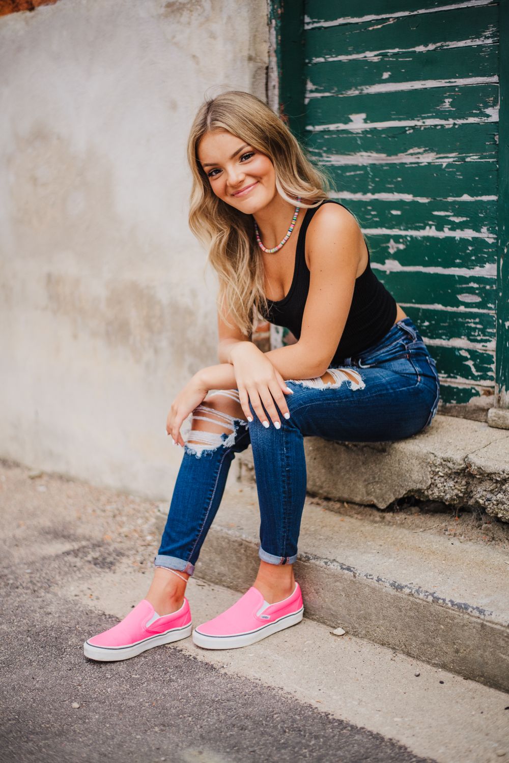 Lifestyle photos showing pink sneakers and distressed jeans against a rustic backdrop.