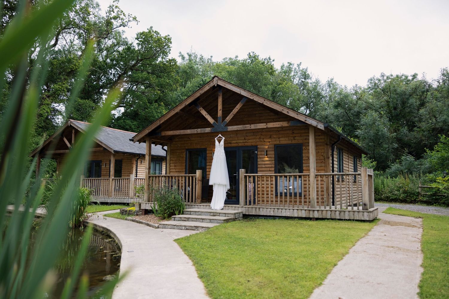 wedding dress hanging outside at one of the lodges at Canada Lodge Wedding