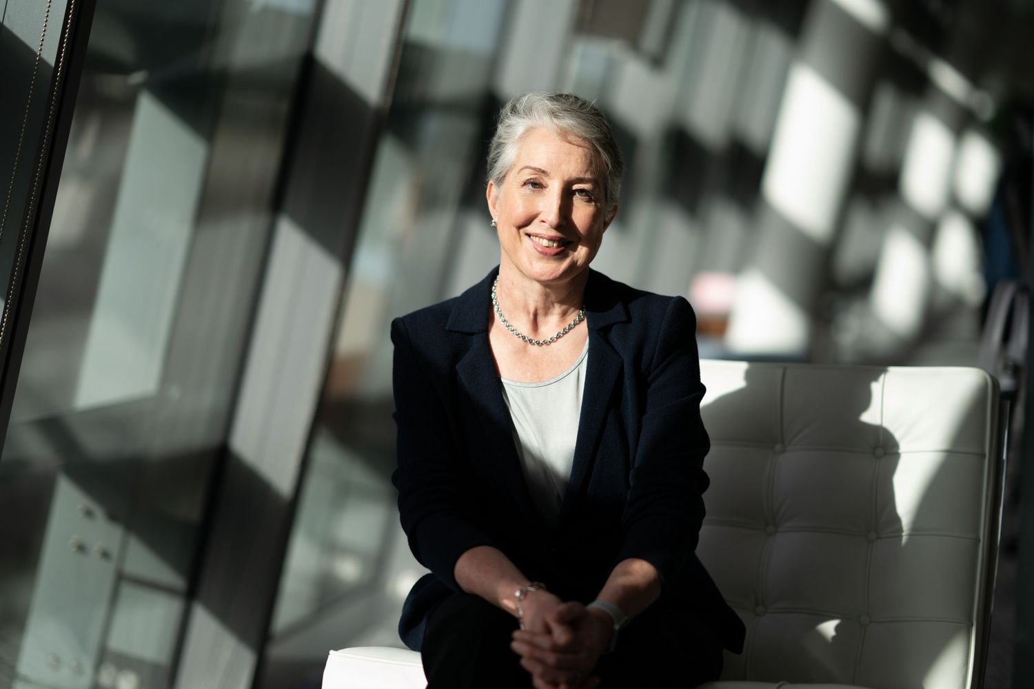 Portrait of a lady in sunlit office near Aldgate. Portrait Photography rates