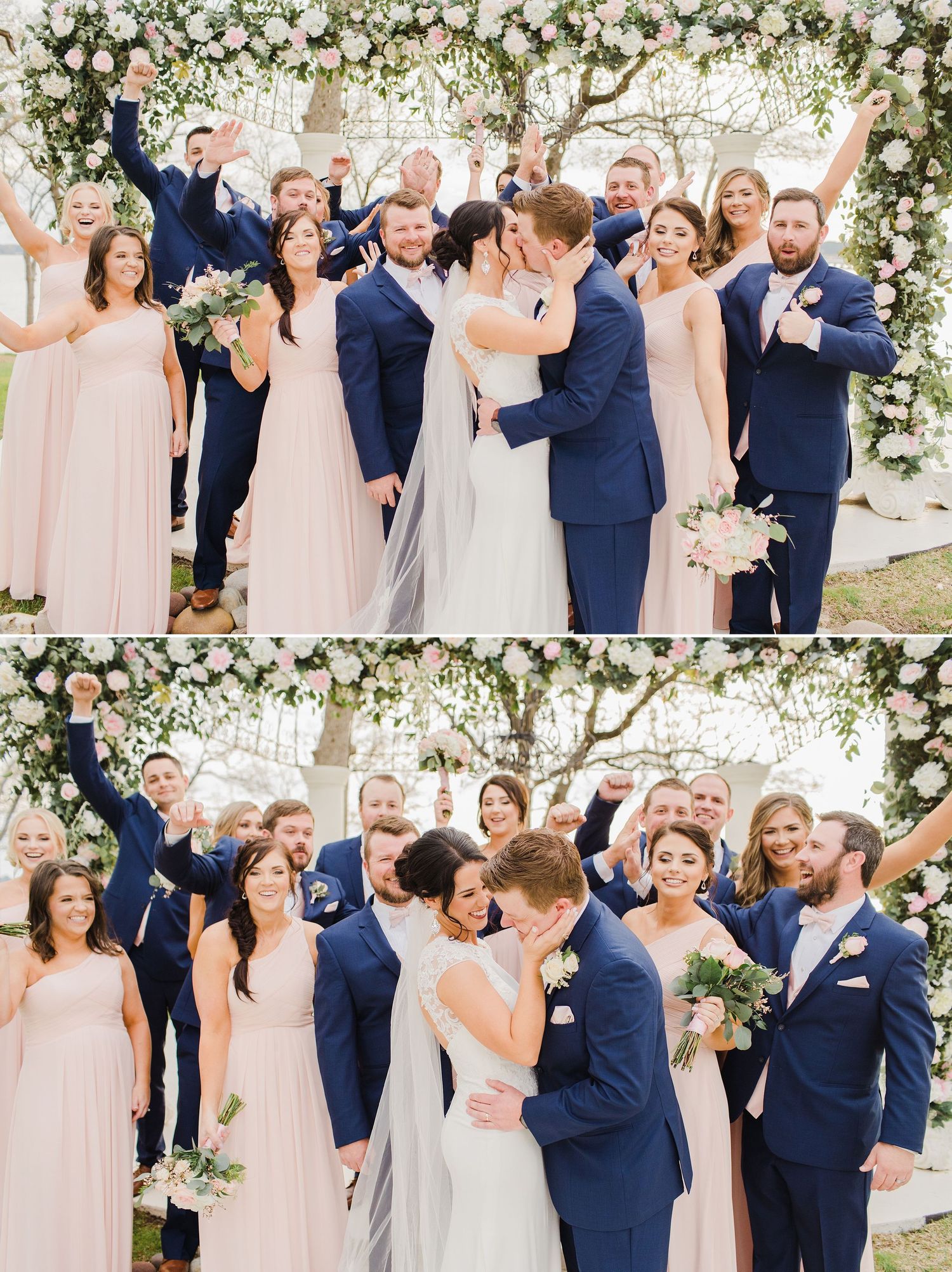Wedding party celebrating under floral arch with pink and white decor.