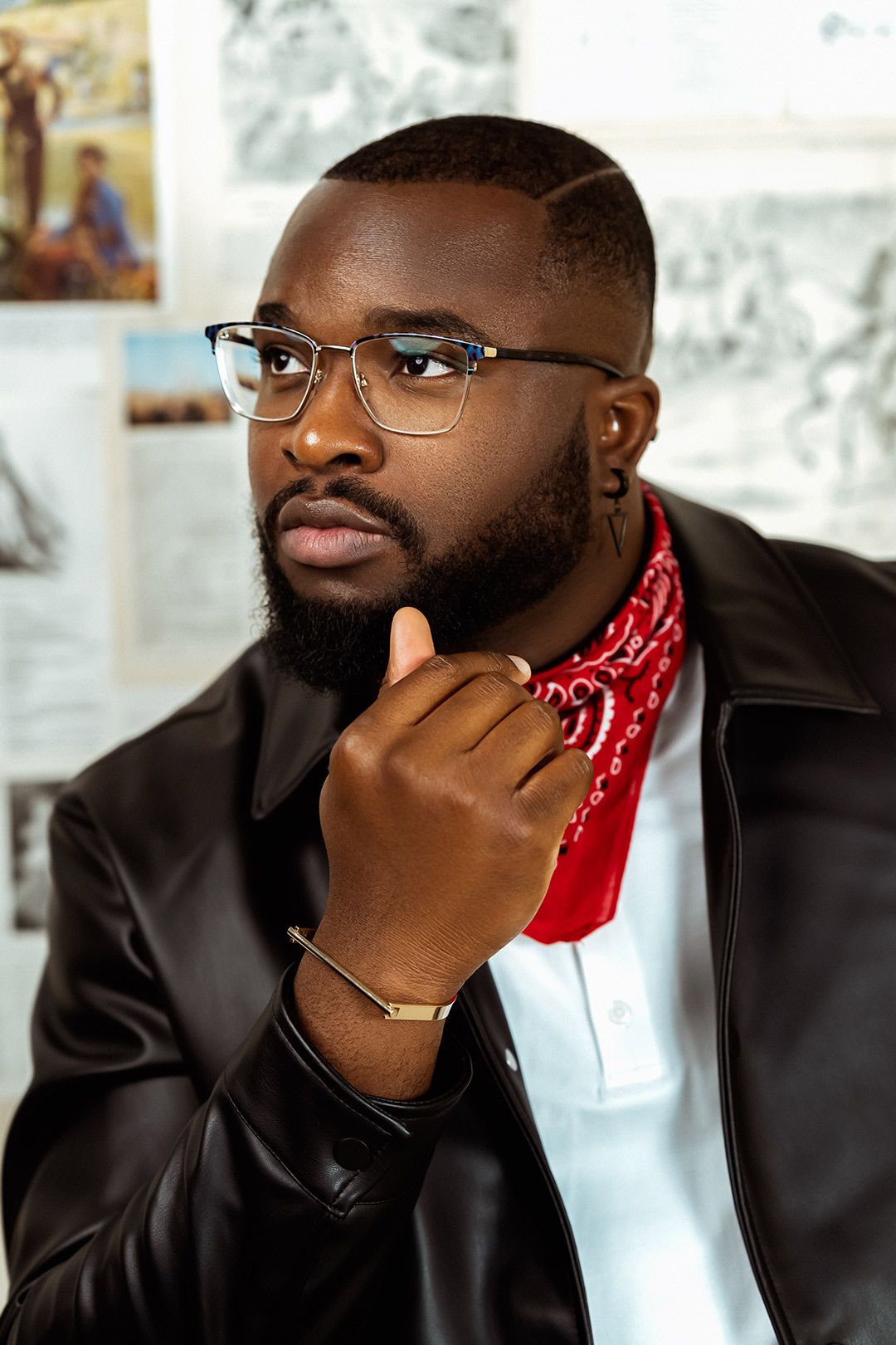 Portrait of a young man wearing a red wild rag and a jacket