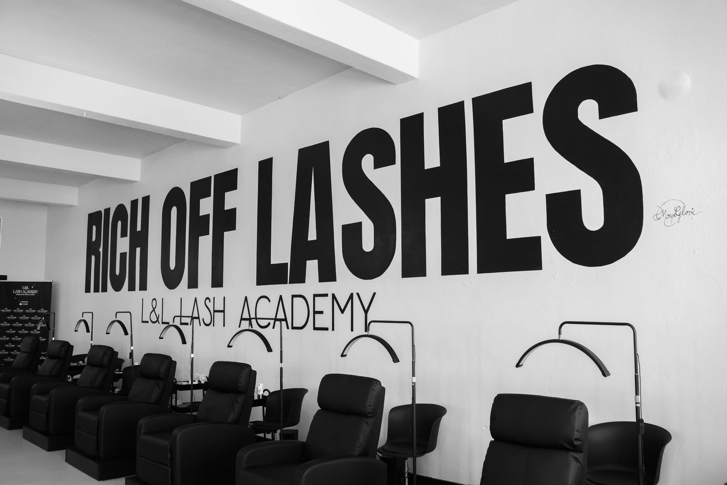 Black and white wall signage displaying text in contemporary design style.