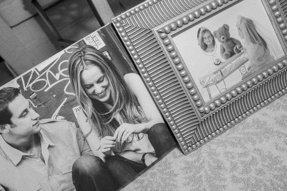A collection of black and white photographs show people joyfully smiling and posing for casual portraits.