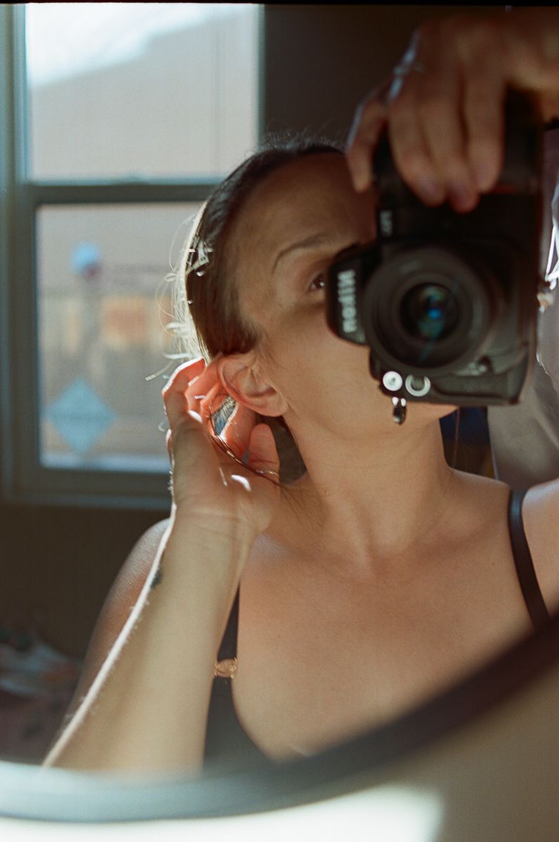Close-up sequence of someone using a camera lens to take photos.